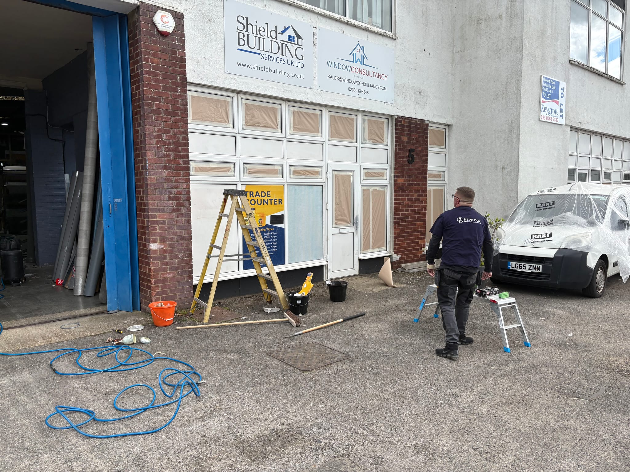Shop Front Spraying project in Hythe: Trade counter frontage prepared for spraying